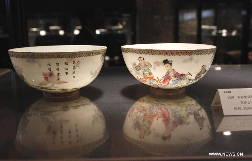 Photo taken on March 21, 2012 shows a set of chinaware displayed during the preview of the 29th China Guardian Quarterly Auction in Beijing. The three-day quarterly auction will kick off here on March 24, following a three-day preview that started on Wednesday. The preview exhibits some 2,600 Chinese painting and calligraphy works, 1,800 pieces of chinaware, furniture and craftwork, as well as 680 rare books and manuscripts.